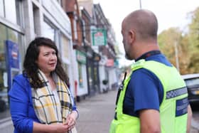 Victoria talking to a local police officer