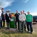 Dignitaries unveiling solar powered defibrillator
