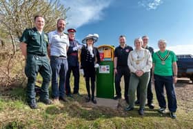 Dignitaries unveiling solar powered defibrillator