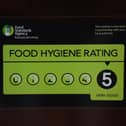 A Food Standards Agency rating sticker on a window of a restaurant in central London. Image: Victoria Jones