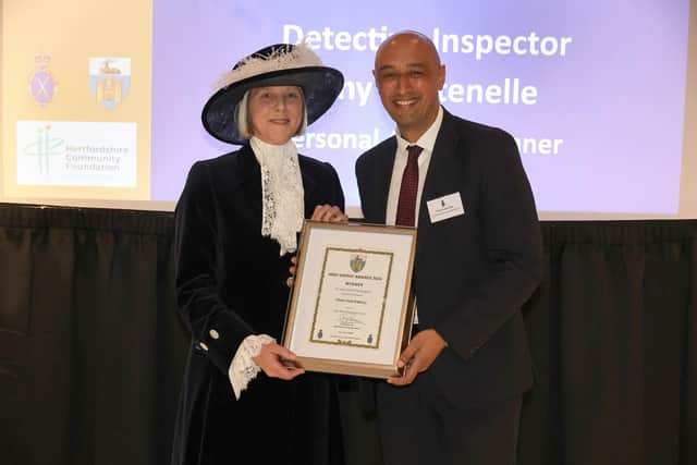 DI Fontenelle receiving the award from the High Sheriff for Hertfordshire.