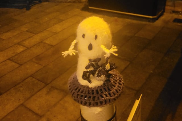 This scared ghost is sitting with a shocked face on his bollard