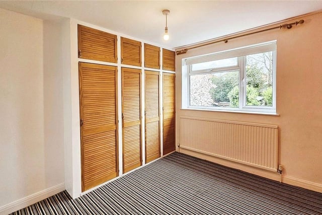 A smart second double bedroom offers yet more storage with fitted wardrobes.