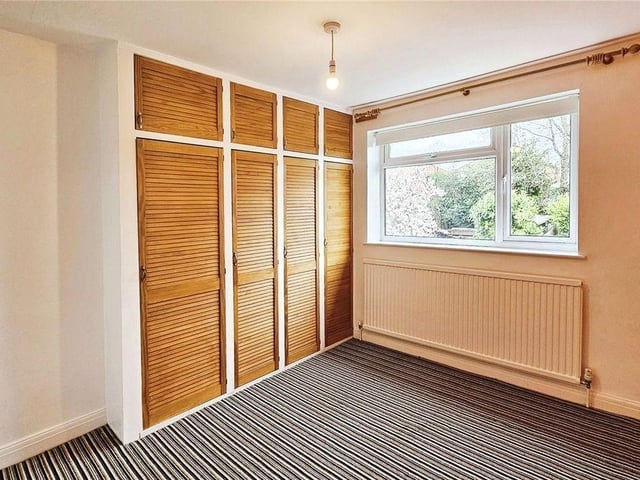 A smart second double bedroom offers yet more storage with fitted wardrobes.