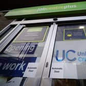 Experts warn thousands of people across Britain have lost support as they move from legacy benefits to Universal Credit. Photo: Yui Mok PA