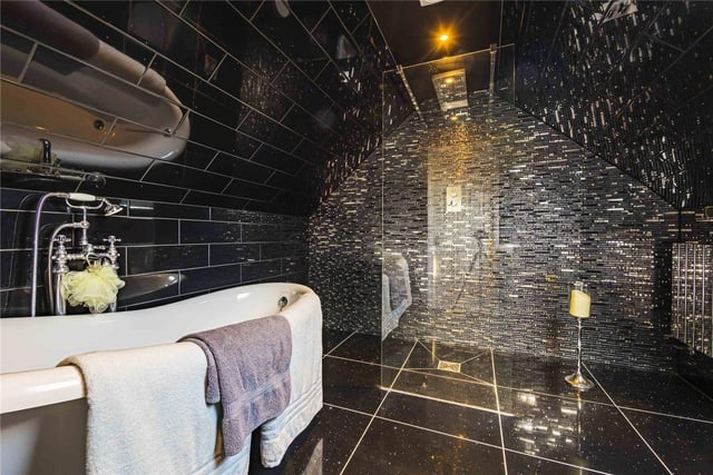 This luxury style bathroom doubles as a walk-in wet room.