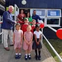 Sir Mike Penning with Neysa Claridge (Head), Jenny Batchelor, Chris Turrell and a selection of child