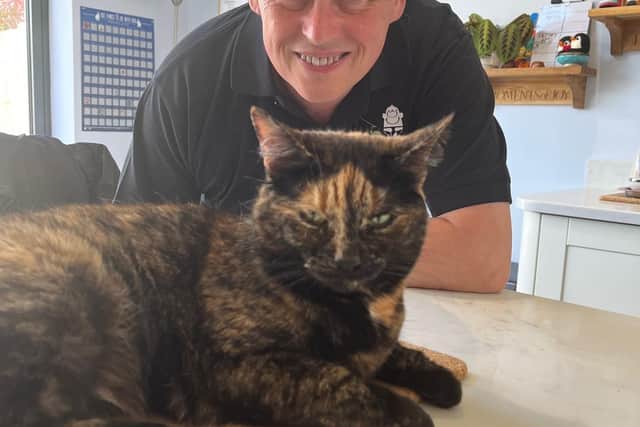 Des Royle with his cat, Tiffany, nicknamed Shadow