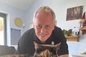 Des Royle with his cat, Tiffany, nicknamed Shadow