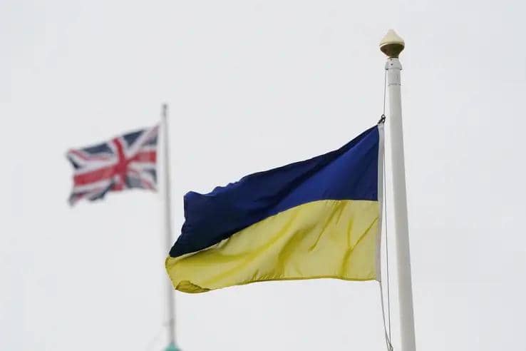 Pictured: Ukrainian and British flags