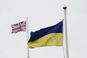 Pictured: Ukrainian and British flags