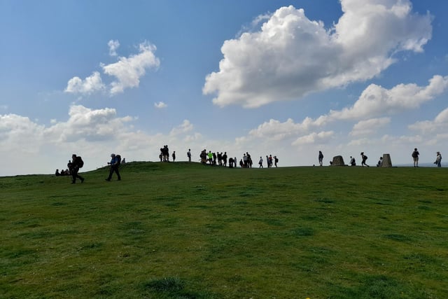 Walkers on the hill with a clouded, blue sky. 
Taken by Charlie, submitted by Roisin Gregory.