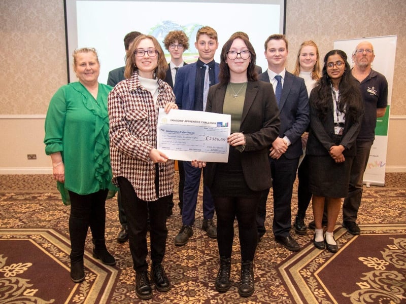 Team Hydra from JFK School who raised the most amount of money presenting their cheque to the charity Waterways Experiences and with their dragon Sharon Abbott from SMA HR.