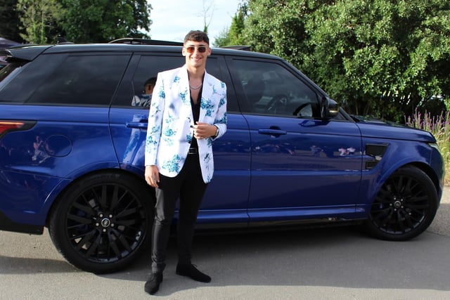 A student arrives in a blue Range Rover to their prom at Shendish Manor.
