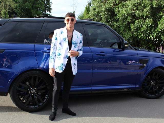 A student arrives in a blue Range Rover to their prom at Shendish Manor.