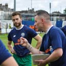 Brad Quinton talks to his players before the win at Welling. Photo: HHTFC.