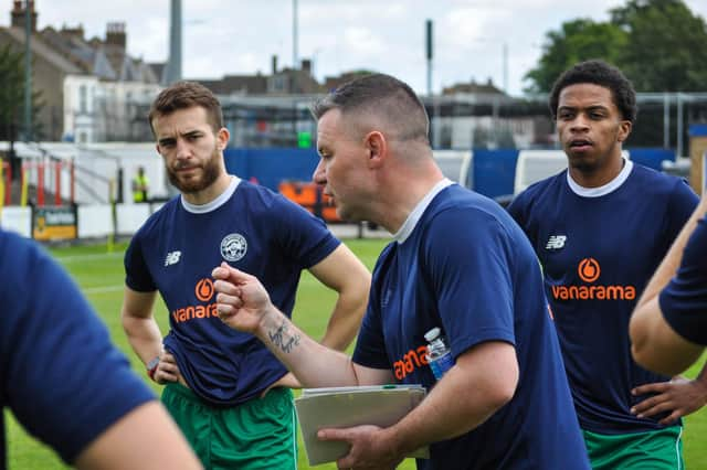 Brad Quinton talks to his players before the win at Welling. Photo: HHTFC.