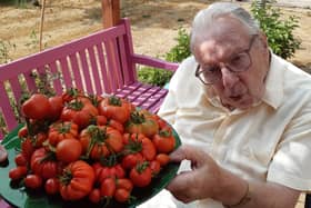 Pictured: David with his home-grown tomatoes