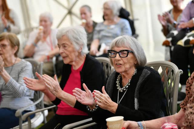 Residents join in the singing at WaterFest