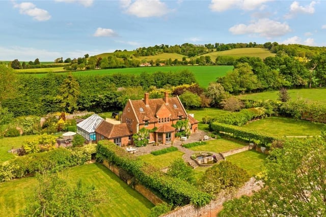 This six-bedroom house is on sale with Savills in Harpenden and could set you back at least £3,500,000 at auction. Nestled in the medieval village of Aldbury, the house sits in a Georgian walled garden and has a yoga studio and an indoor pool.