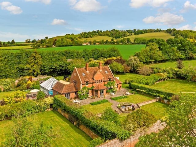 This six-bedroom house is on sale with Savills in Harpenden and could set you back at least £3,500,000 at auction. Nestled in the medieval village of Aldbury, the house sits in a Georgian walled garden and has a yoga studio and an indoor pool.