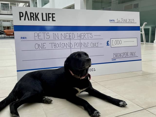 Snuggles accepts Community Fund cheque on behalf of Pets in Need Herts