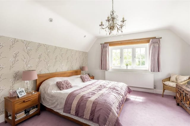 The main bedroom has a luxurious four piece en suite bathroom and large dressing room and it can also be accessed via a second staircase which leads into the kitchen.
