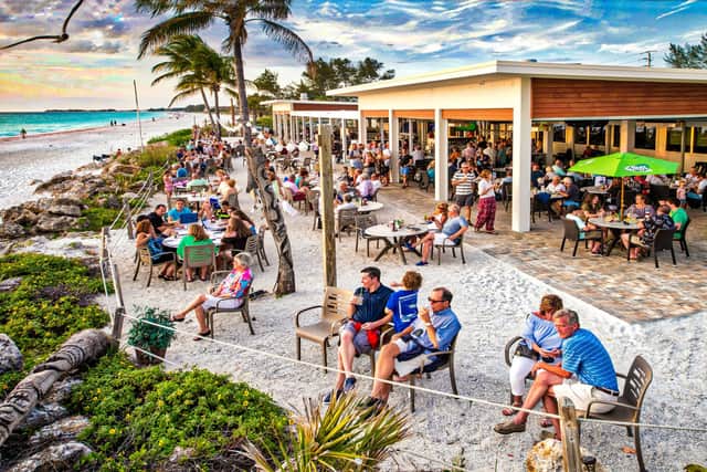 Eat with your toes in the sand at The Beach House restaurant