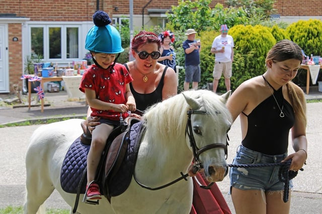 Neigh-bours joined together for a street party, while the children enjoyed pony rides.