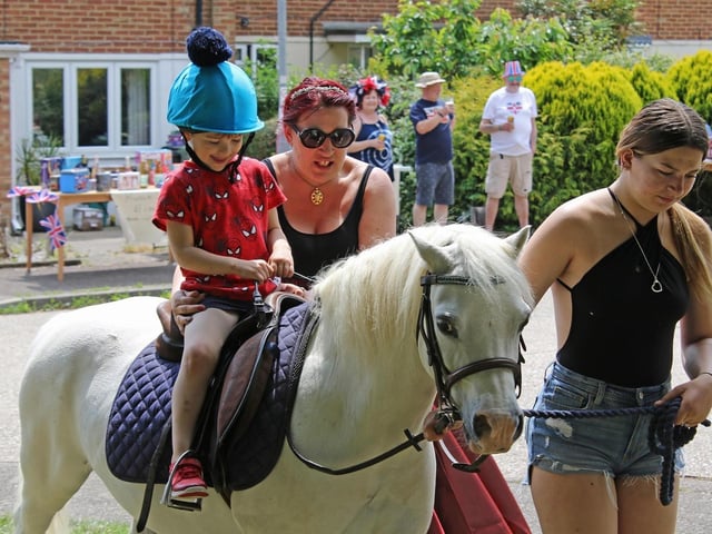 Neigh-bours joined together for a street party, while the children enjoyed pony rides.