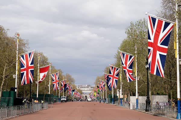 Union flags hanging from the street furniture outside Buckingham Palace on the Mall, London