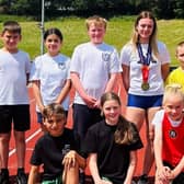Team GB’S U18 Gold Medallist Mia McIntosh with children from Aspire.