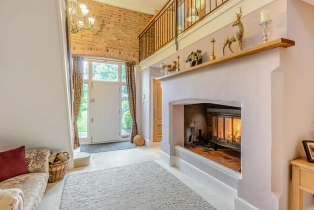 Starting at the front door, you are greeted by a large hallway with a log burning fire, seating and staircase to the first floor.