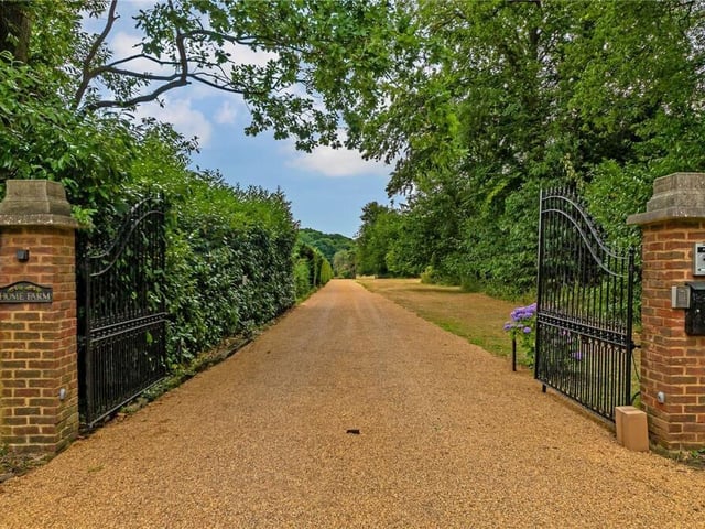 Right off the main road is the entrance to this fantastic property. The electric gates give added security before driving down the path to get to the main house.