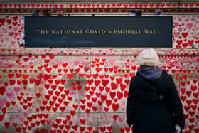 A person looks at National Covid Memorial Wall Photo from Victoria Jones PA Images