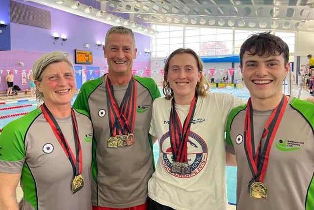 Berkhamsted SC's Masters swimmers with their haul of medals.
