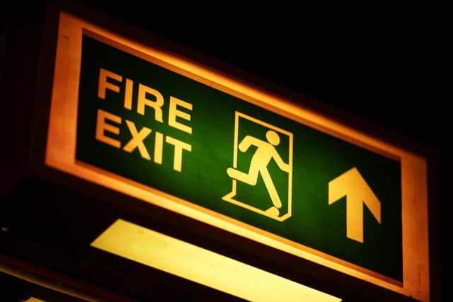 A fire exit sign. Photo from Andrew Parsons/ PA Images