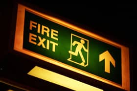 A fire exit sign. Photo from Andrew Parsons/ PA Images