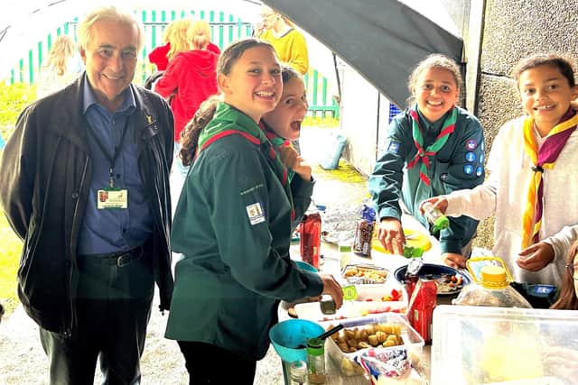Cllr Laurence Brass attending the Scout Hut of the 64th Bushey and Oxhey Scout Group with members of the local troop. Cllr Brass contributed a donation to assist towards refurbishment.
