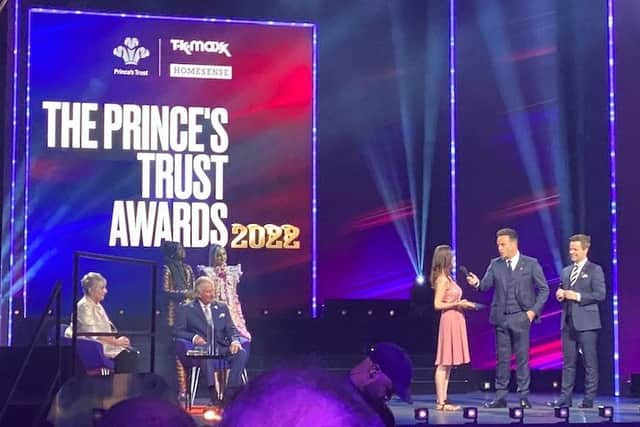 Ella on stage with Ant and Dec after getting her award from Prince Charles.