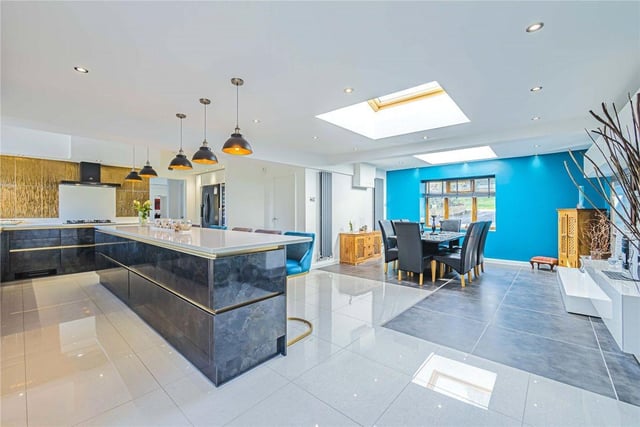 The open-plan kitchen and dining area offers stylish living for the modern family.