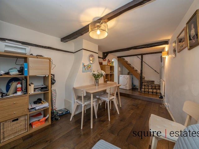 The kitchen flows into a quaint dining area.
