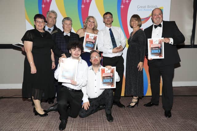 Hightown's VoiceBox group receiving their Great British Care award