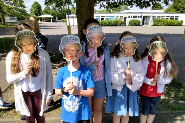 Pupils donned Queen masks on Friday.