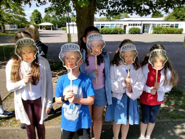 Pupils donned Queen masks on Friday.