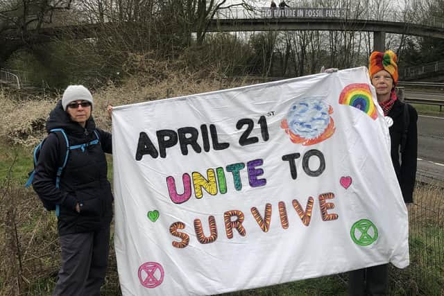 Drivers on the A41 were invited to join a Unite to Survive event in London next month when activists unfurled a banner under Tring Park Bridge.