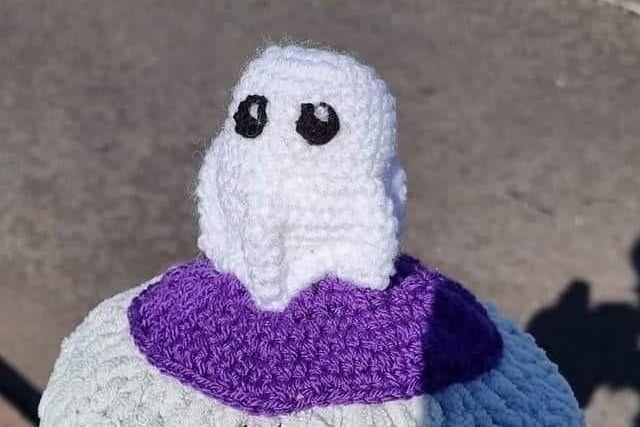 This little ghost looks cute as he sits on a bollard