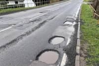 Potholes spotted in nearby Buckinghamshire used for illustrative purposes