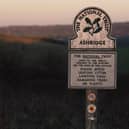 Sunset: A National Trust marker bearing the title "Ashridge" at Ivinghoe Beacon in the Chiltern Hills, Buckinghamshire. Credit: Will Durrant/LDRS