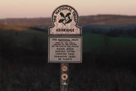 Sunset: A National Trust marker bearing the title "Ashridge" at Ivinghoe Beacon in the Chiltern Hills, Buckinghamshire. Credit: Will Durrant/LDRS